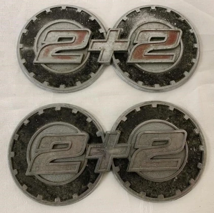 Find & Bid On Lot# 415 - (2) 2+2 Emblems - Now For Sale At Auction