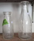  Preview image for Lot# 299c - 2 Embossed Milk Bottles. Bre 