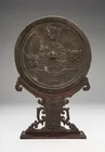  Preview image for A Chinese bronze mirror, 11 3/4 x 7 1/8 