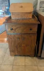  Preview image for wood cabinet and a royce basket 