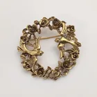  Preview image for GOLD TONE FLOWERS AND BIRDS WREATH ROUND 