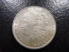  Preview image for **AU** 1887 Morgan Silver Dollar 
