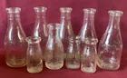  Preview image for Nine Older Embossed Advertising Bottles 
